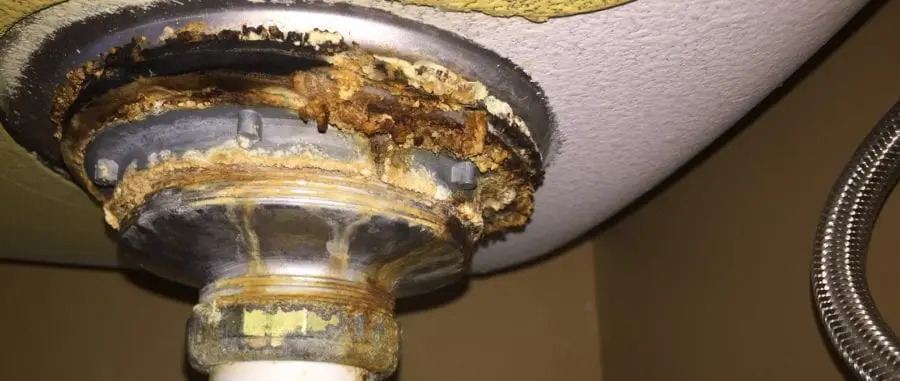 Leaky pipe under a kitchen sink